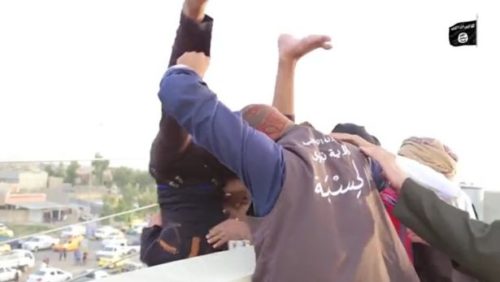 2 masked men throwing another off a building