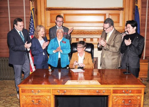 Kansas Governor Laura Kelly (D) signs an executive order restoring employment protections for LGBTQ state employees. Kansas Governor Laura Kelly (D) signs an executive order restoring employment protections for LGBTQ state employees.