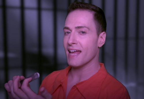 Randy Rainbow in an orange jumpsuit.