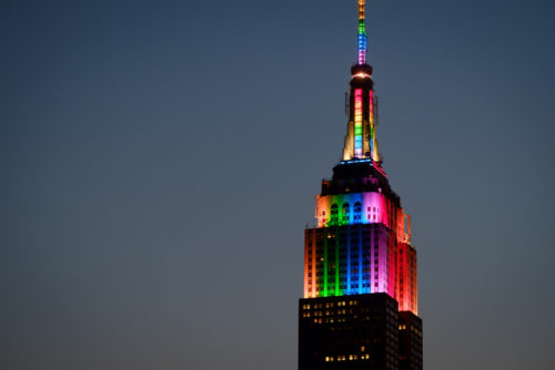 Top of Empire State Building at twilight in rainbow colors in honor of the Orlando shooting victims - June 26, 2016 Top of Empire State Building at twilight in rainbow colors in honor of the Orlando shooting victims - June 26, 2016