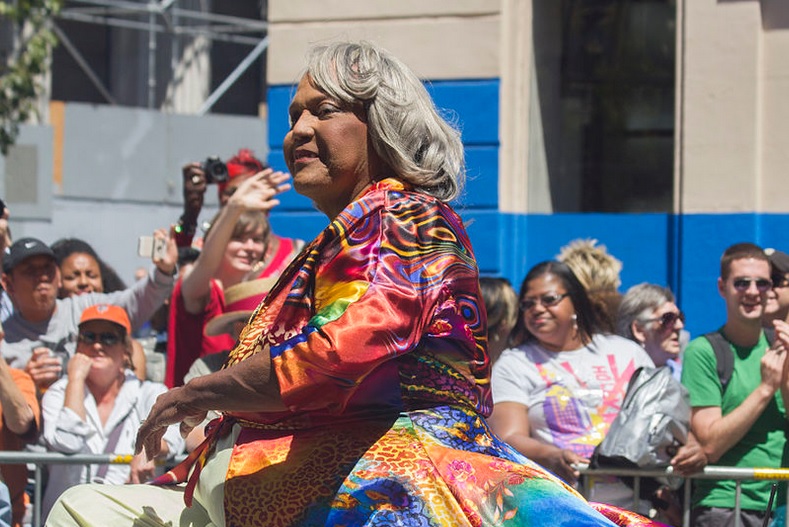 Miss Major in a colorful dress