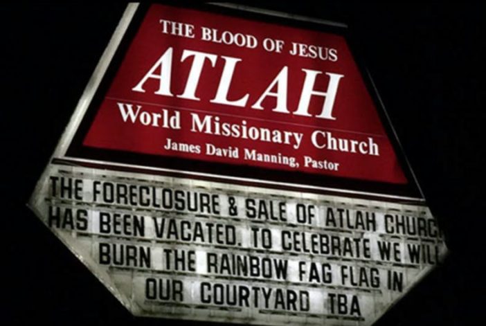 A church sign calling to "burn the rainbow fag flag"