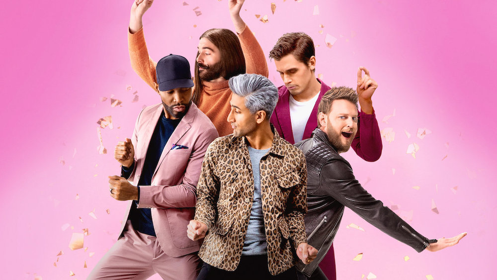 The 5-member cast of Netflix's Queer Eye, also known as the Fab Five, poses in front of a pink studio backdrop.