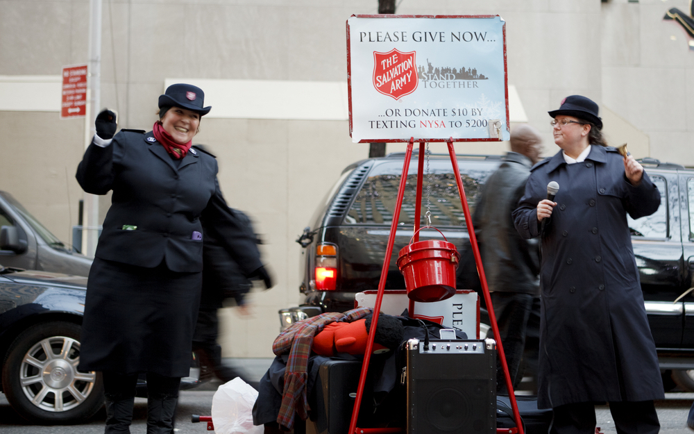 Cheerful Salvation Army people collecting for the Holidays at Rockefeller Center.