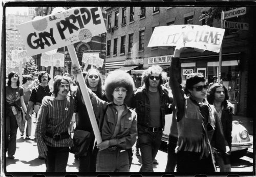 People hold 'Gay Pride' and 'Mattchine' (The Mattachine Society was a early American gay rights organization) signs during the first Stonewall anniversary march, then known as Christopher Street Liberation Day (and later Gay Pride Day), as they parade along 6th Avenue in New York, June 28, 1970. 