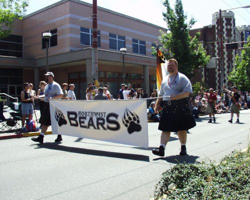 Paul Quesnell holding the Northwest Bears banner while marching in the Seattle Pride Parade, June 28 2004.