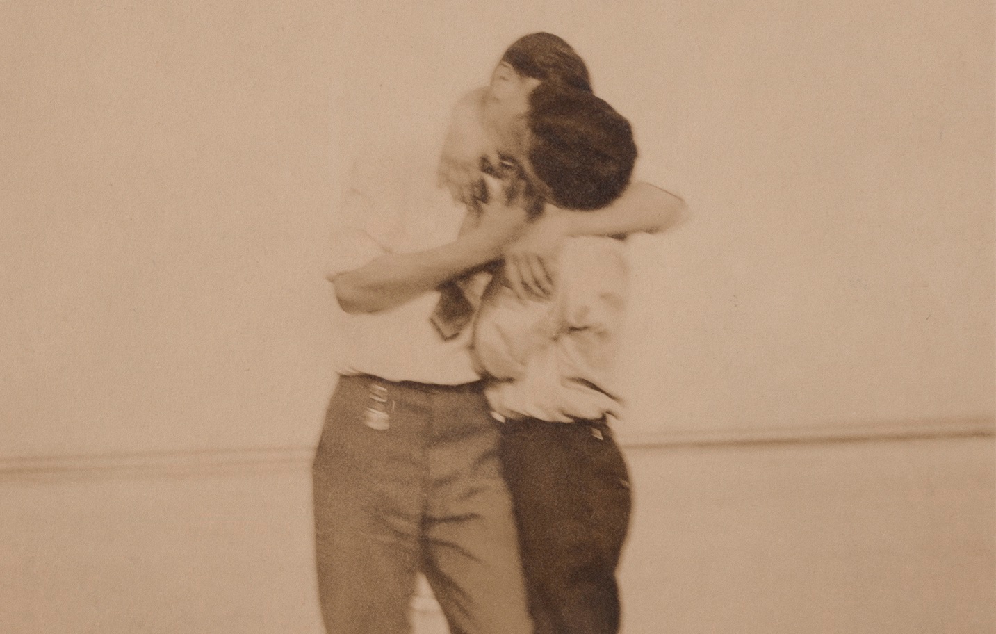 Two men kiss on Labor Day 1910
