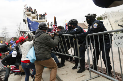 Supporters of U.S. President Donald Trump clash with police officers outside of the U.S. Capitol Building in Washington, U.S., January 6, 2021.