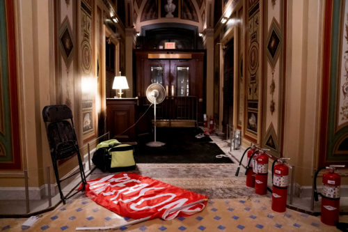 A discarded flag reading "Treason" lays on the floor inside the U.S. Capitol, Washington, D.C., U.S., Jan. 6, 2021.