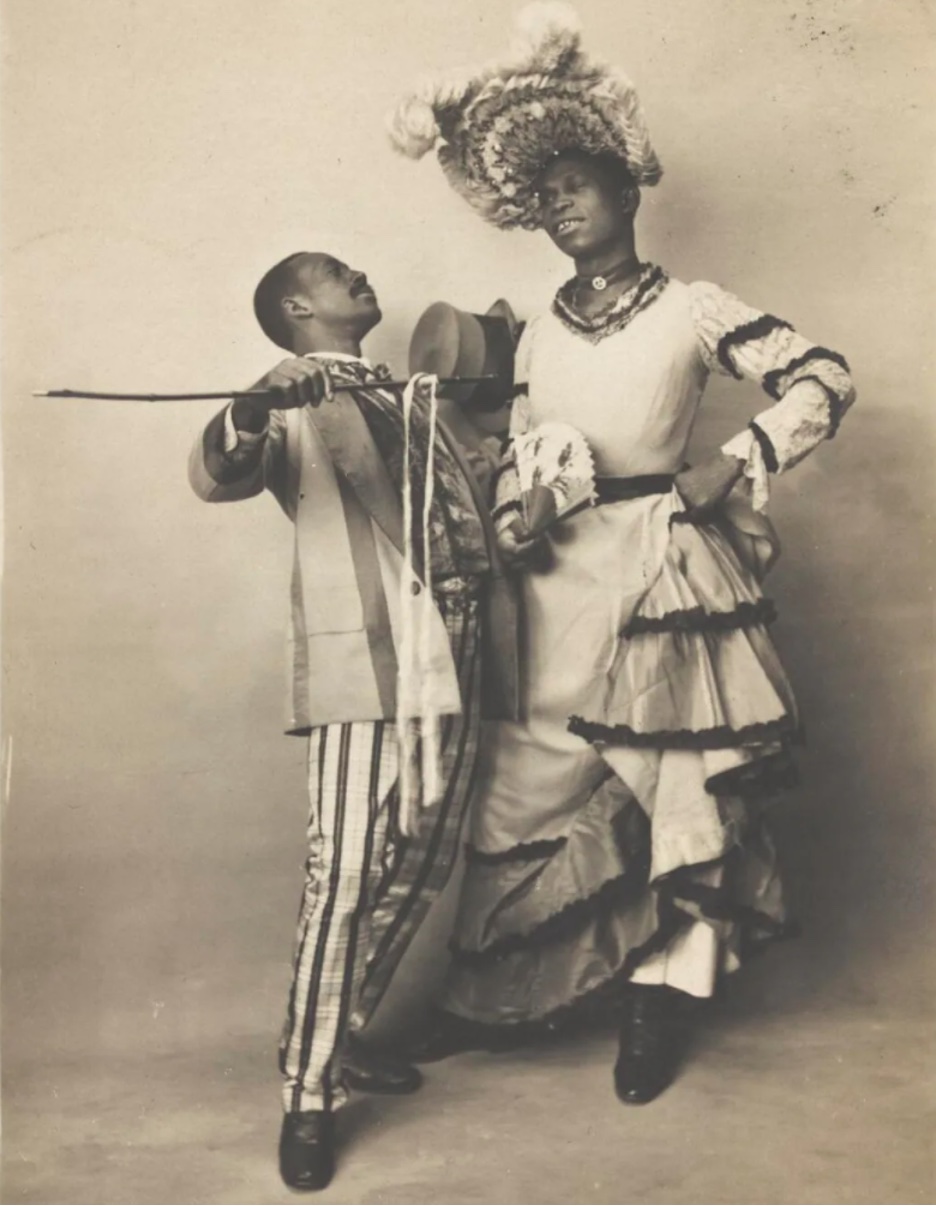 A Black drag queen and a male performer, circa 1903.