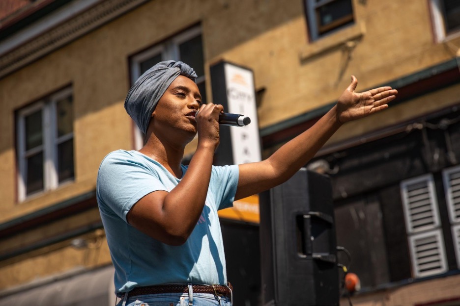 Honey Mahogany addresses the crowd at the Riot Party.