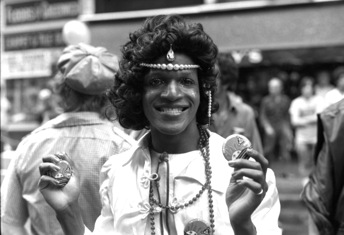 American gay liberation activist Marsha P Johnson (1945 - 1992) (left) during the Pride March (later the LGBT Pride March), New York, 1975