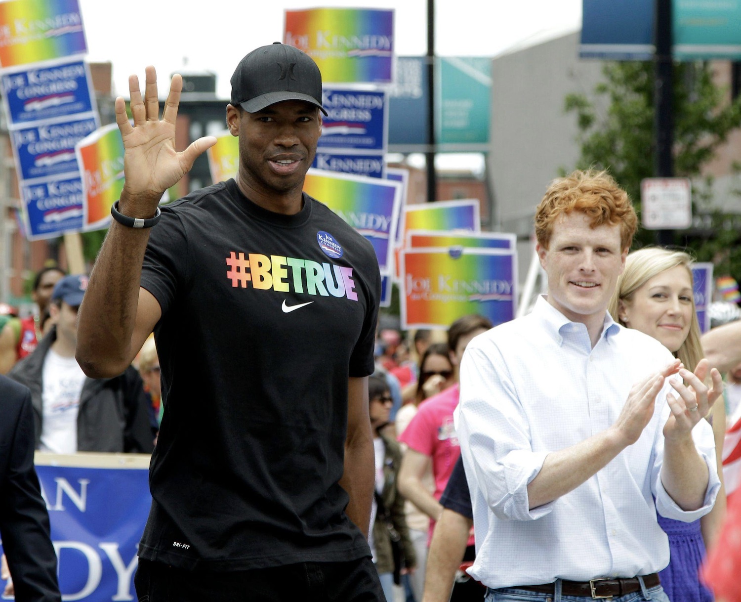 Jason Collins, the first active player in one of four major U.S. professional sports leagues to come out, marches in Boston's pride parade alongside U.S. Rep. Joe Kennedy III, a college roommate, Saturday, June 8, 2013, in Boston. Photo: Mary Schwalm via the Associated P  ress