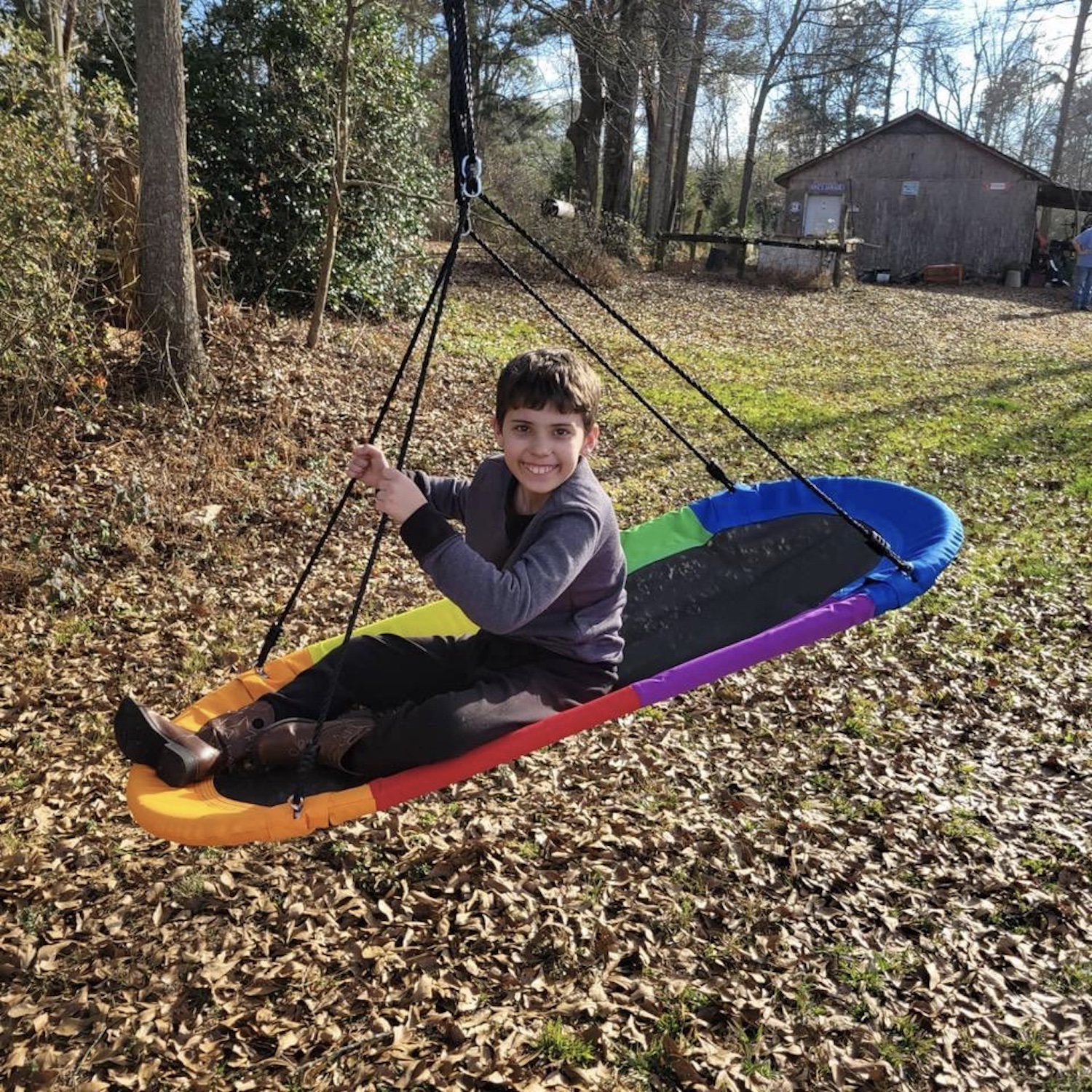 Brayden Glassco in his new swing on the family’s land in Marshall County, Alabama. Photo courtesy the Glassco family