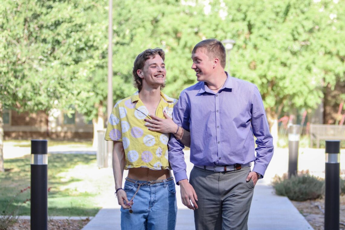 Trevor strolling on the Texas Tech campus with his boyfriend, Joshua Adamek. Photo by Topher Covarrubio for LGBTQ Nation