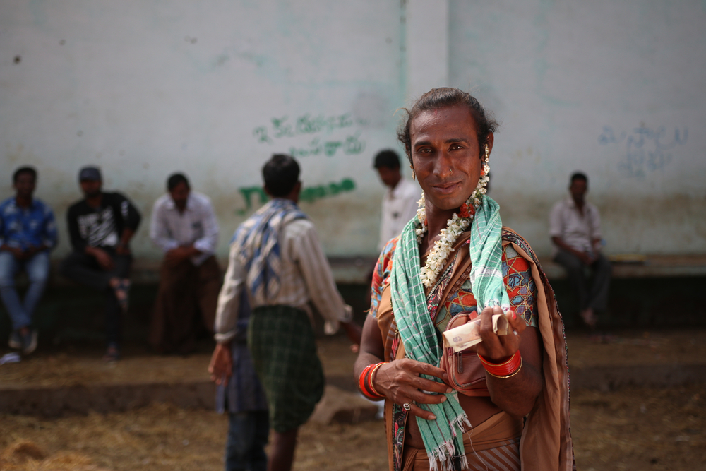 ANANTAPUR, ANDHRA PRADESH / INDIA - DECEMBER 26, 2009: Transgender woman begging in a market