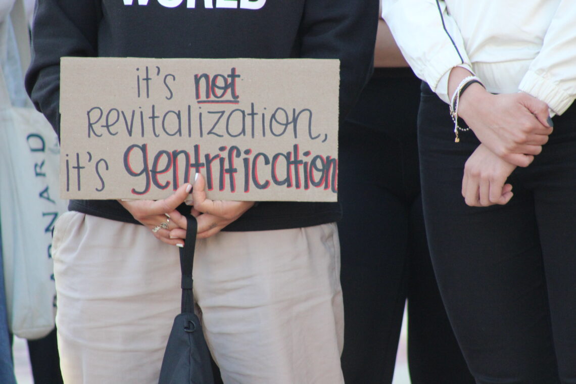 Activists protest outside Columbia University over the school's planned expansion into Harlem