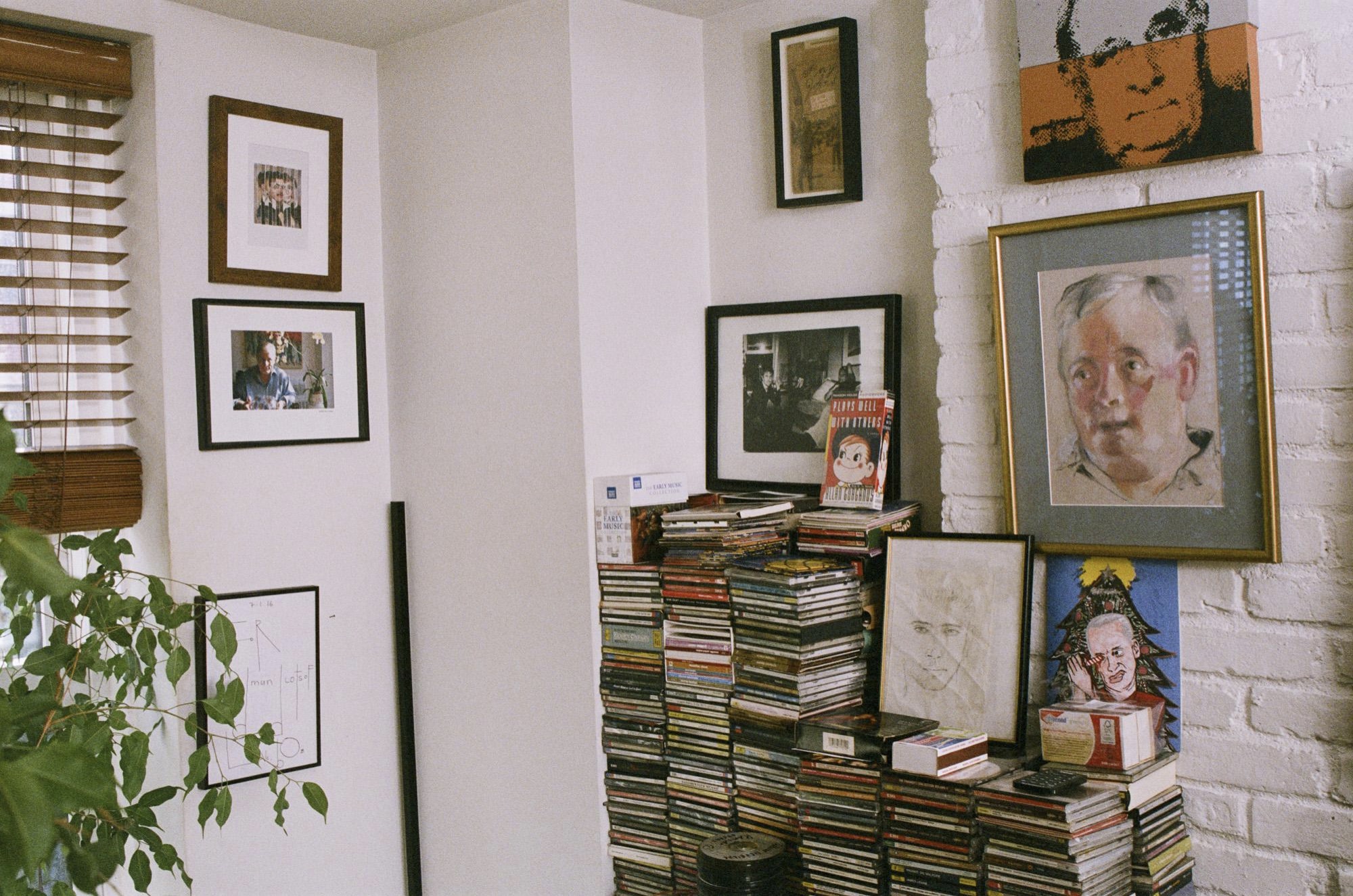 A peek inside Edmund White’s New York City apartment, featuring a collection of portraits, photographs, and media. The prolific author has been writing about LGBTQ life since his first novel, Forgetting Elena, was published in 1973. Photo by Matthew Leifheit