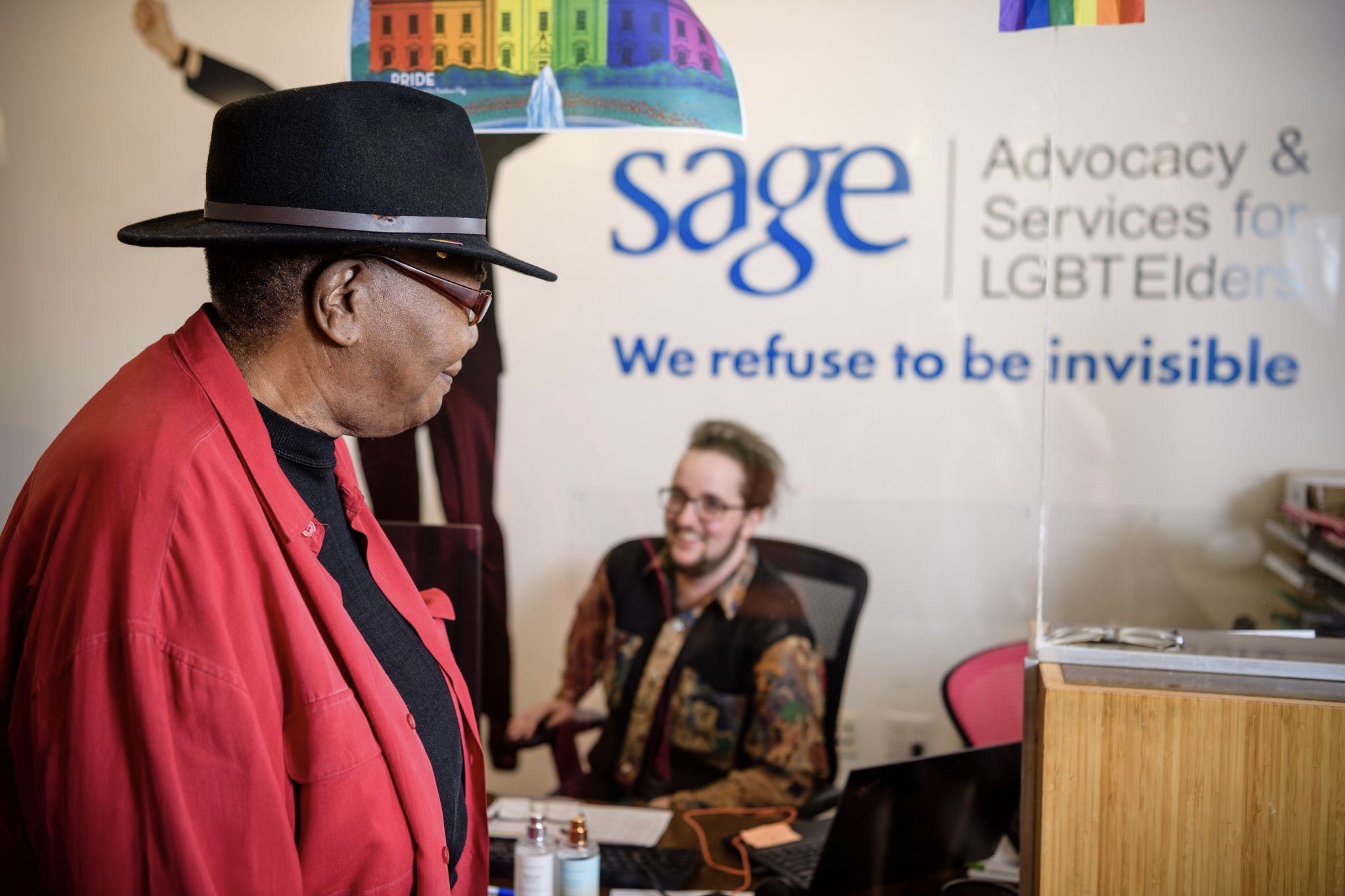 Lujira Cooper, left, checks in with O.K. Fox at the Edie Windsor SAGE Center in New York City on August 24, 2022. Photo by Neil Grabowsky/Through The Lens Studios for LGBTQ Nation.