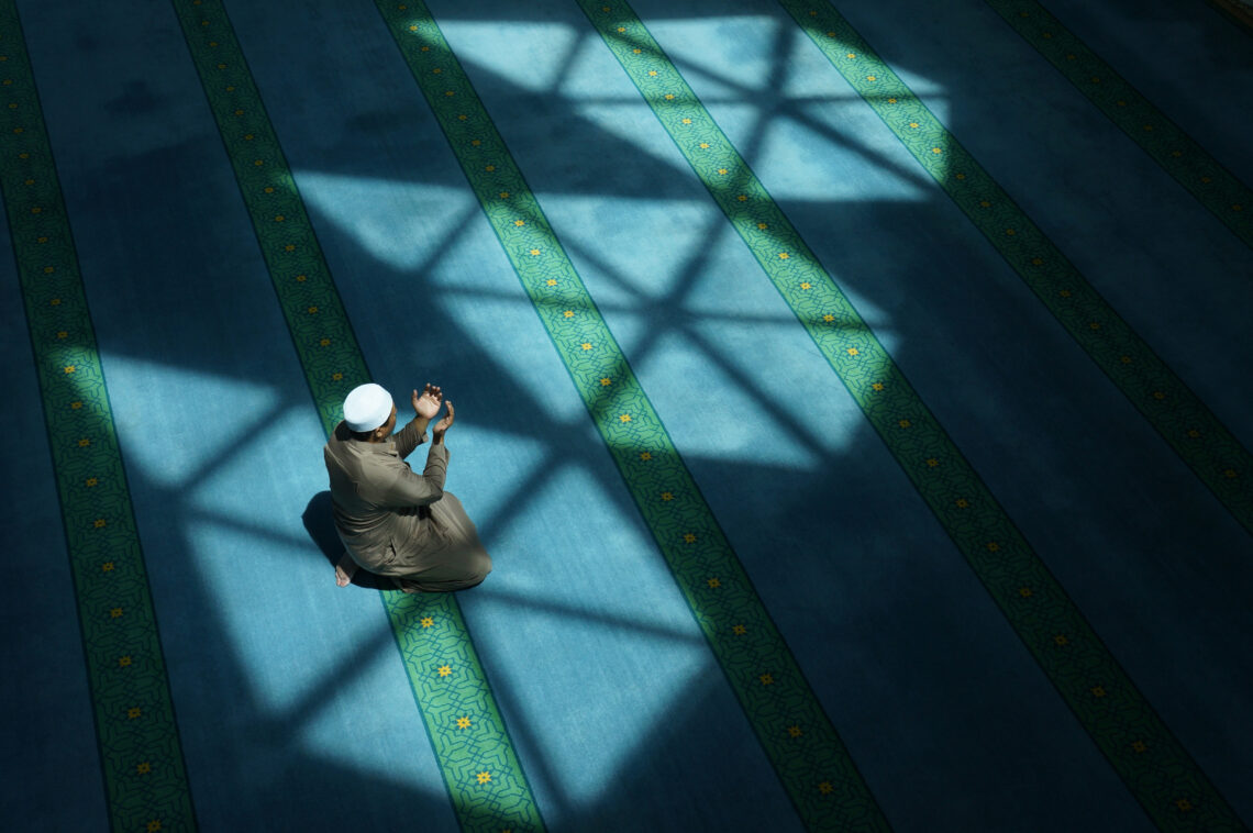 A Muslim man prays inside a mosque in Tehran.