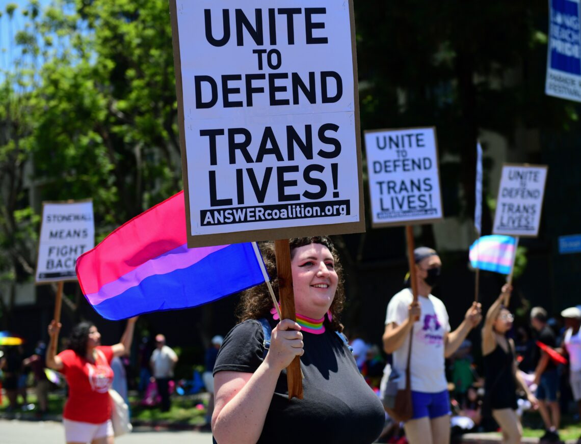 Participants march in the 2022 Long Beach Pride Parade on July 10, 2022 in Long Beach, California. 