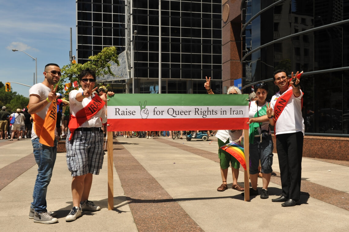 TORONTO, CANADA - JUL 3: Unidentified Gay/Lesbian Iranians in Canada. who would be persecuted for being gay back in Iran, partake in the very popular Pride Parade on July 3, 2011 in Toronto, Ontario.