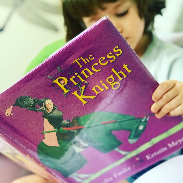 A child reads The Princess Knight